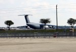 This is the Airplane that carries the President's advance team and armoured cars.